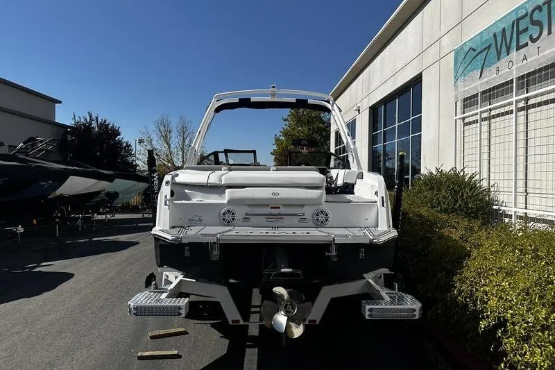 Slide: The Image of 2025 Cobalt CS23 boat displayed outdoors at a dealership. - 3
