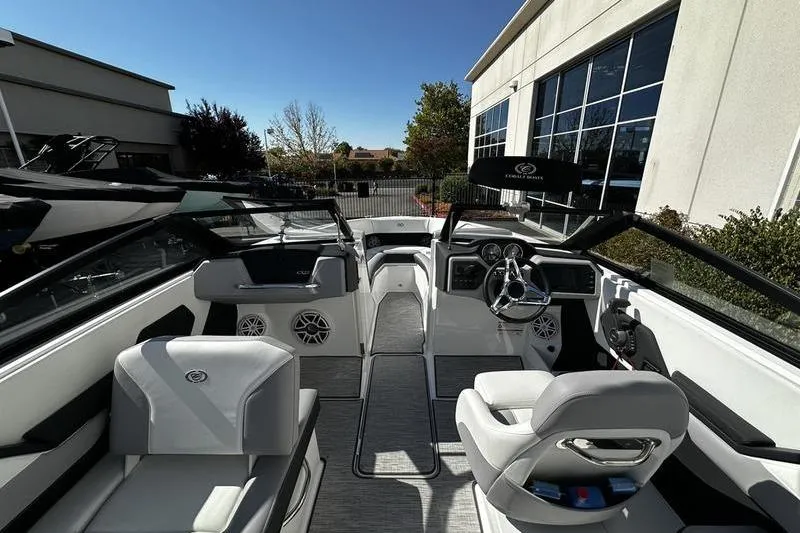 Slide: The Image of Interior view of a 2025 Cobalt CS23 boat, showcasing sleek seating and modern dashboard. - 6