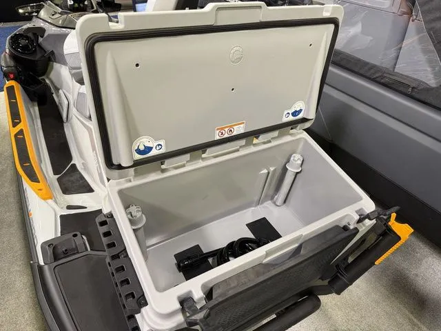 Slide: The Image of Open storage compartment of Sea-Doo FISH PRO 2026 with accessories. - 5