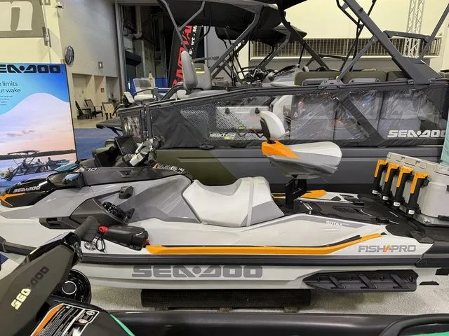 Slide: The Image of 2026 Sea-Doo FISH PRO jet ski displayed at a show. - 4