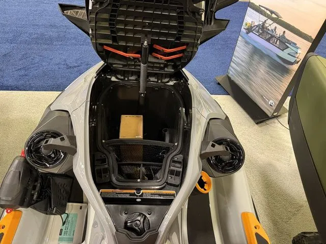 Slide: The Image of 2026 Sea-Doo FISH PRO with open storage compartment at exhibition. - 17