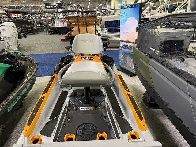 Slide: The Image of 2026 Sea-Doo FISH PRO jet ski at a boat show. - 7