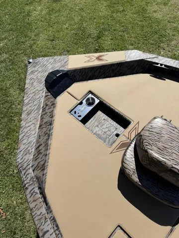 Slide: The Image of 2026 Xpress Hyper-Lift Bass H18 boat displayed on grass. - 13