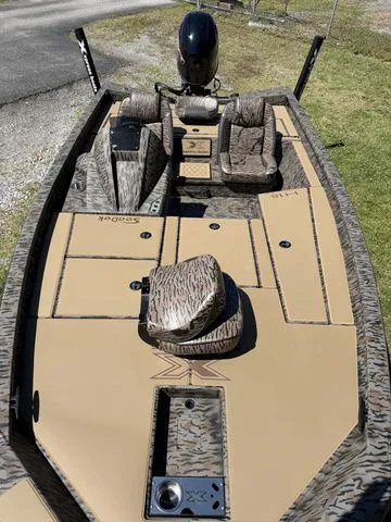 Slide: The Image of 2026 Xpress Hyper-Lift Bass H18 boat with camouflage pattern and two seats. - 6