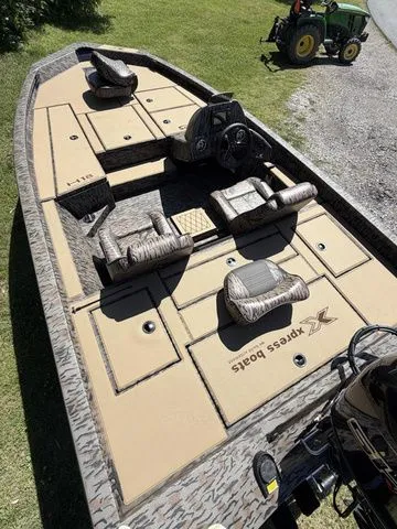 Slide: The Image of 2026 Xpress Hyper-Lift Bass H18 boat with spacious deck and seating. - 7
