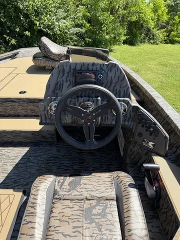 Slide: The Image of 2026 Xpress Hyper-Lift Bass H18 boat cockpit with modern design. - 9