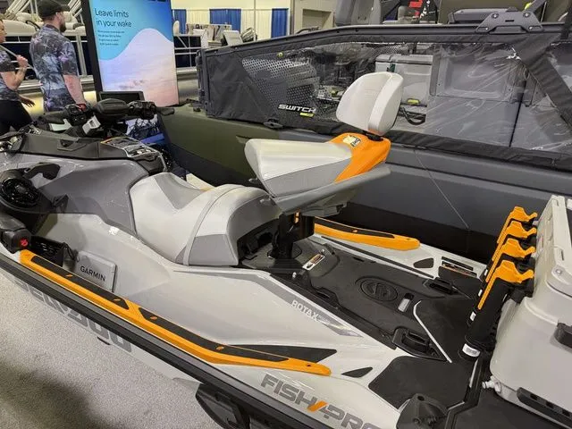 Slide: The Image of 2026 Sea-Doo FISH PRO jet ski displayed at a show. - 6