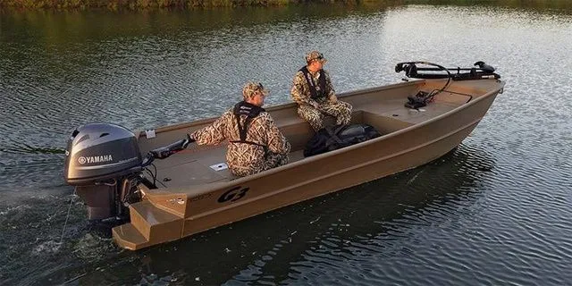 The Image of Two people in a G3 DK18 boat on a calm lake. - 1