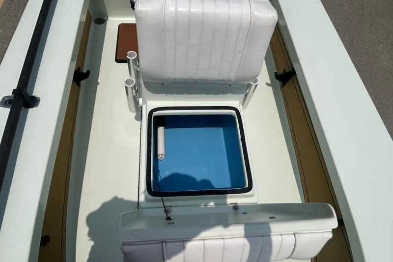 Slide: The Image of 2019 Beavertail Skiffs Mosquito interior with seating and storage compartment. - 12