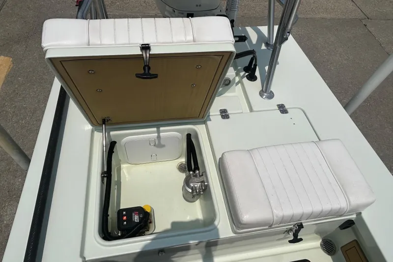 Slide: The Image of 2019 Beavertail Skiffs Mosquito boat interior with open storage compartments and seating. - 13
