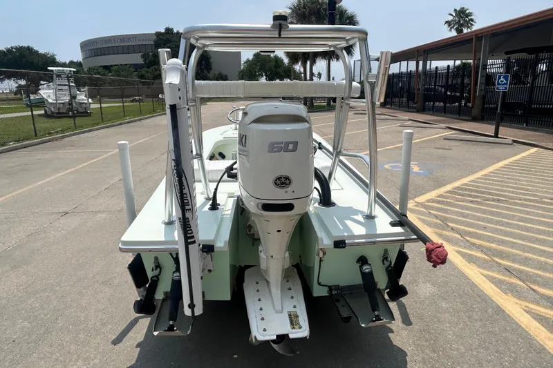 Slide: The Image of 2019 Beavertail Skiffs Mosquito boat with Suzuki 60 engine in parking lot. - 4