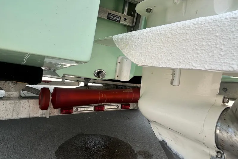 Slide: The Image of 2019 Beavertail Skiffs Mosquito boat trailer detail with red roller and metal components. - 7
