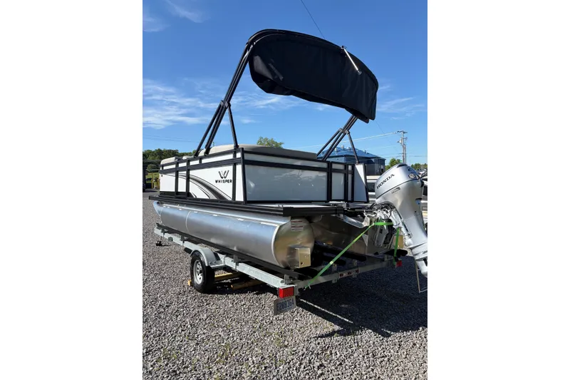Slide: The Image of 2026 Whisper S17 pontoon boat with canopy and Honda outboard motor on trailer. - 3
