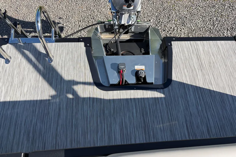Slide: The Image of Rear deck of Whisper S17 boat, 2026 model, featuring motor mount and textured flooring. - 9