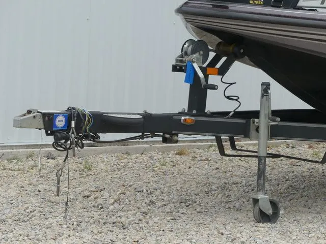 Slide: The Image of 2017 Skeeter TZX190 boat trailer on gravel surface. - 11