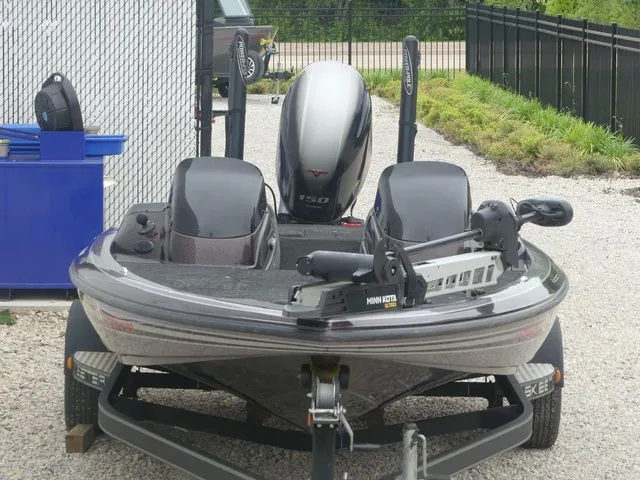 Slide: The Image of 2017 Skeeter TZX190 boat on trailer, outboard motor visible. - 13