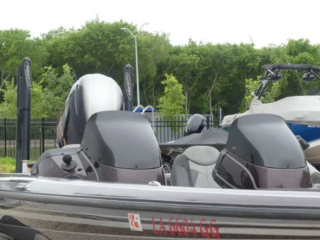Slide: The Image of 2017 Skeeter TZX190 boat with outboard motor, parked outdoors. - 15