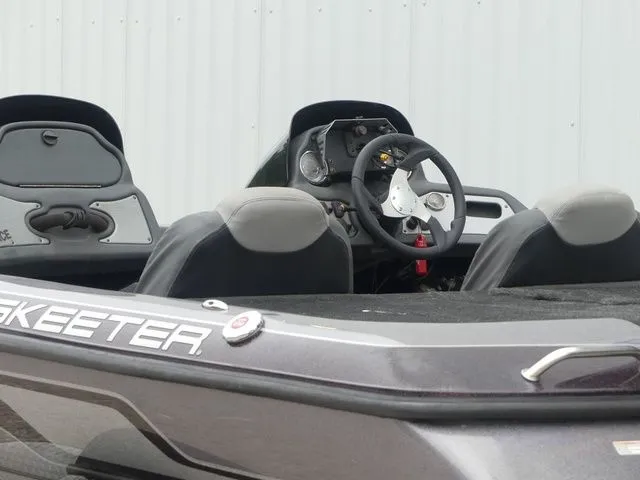 Slide: The Image of 2017 Skeeter TZX190 boat interior with steering console. - 17