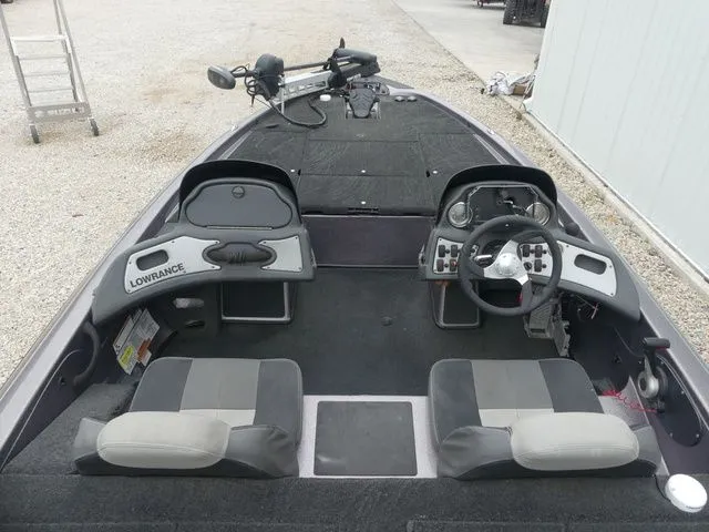 Slide: The Image of Interior view of a 2017 Skeeter TZX190 boat with steering console. - 19
