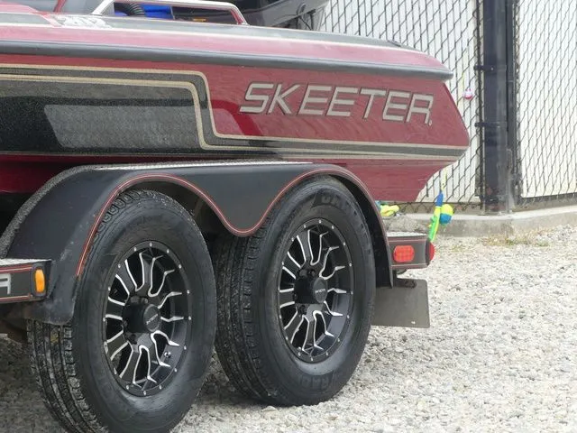 Slide: The Image of 2000 Skeeter ZX202 boat trailer with stylish wheels. - 11