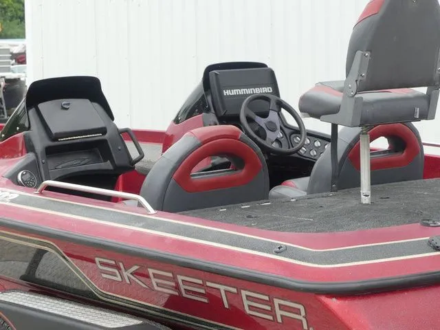 Slide: The Image of Red 2000 Skeeter ZX202 boat with Humminbird controls. - 18