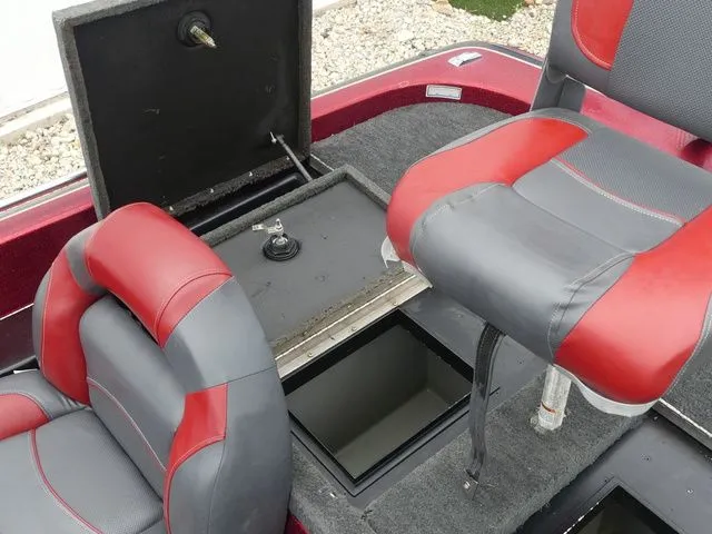 Slide: The Image of Interior of a 2000 Skeeter ZX202 boat with red and gray seats. - 27