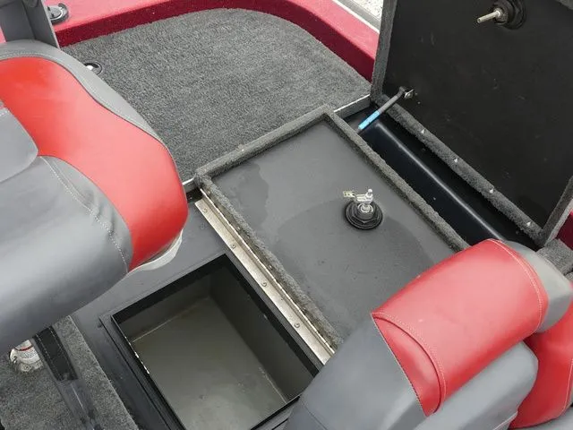 Slide: The Image of Interior of a 2000 Skeeter ZX202 boat with storage compartment. - 28