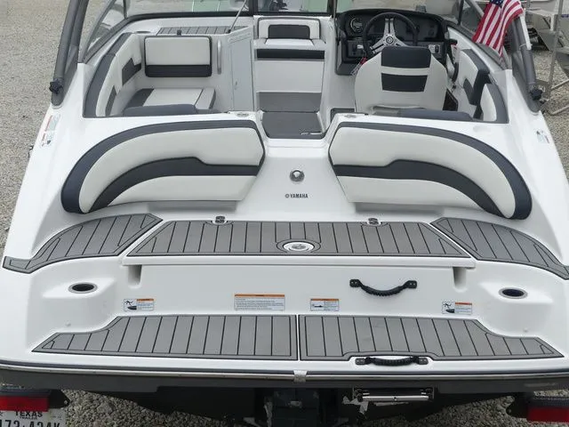Slide: The Image of Rear view of a 2019 Yamaha AR195 boat with gray seating. - 16