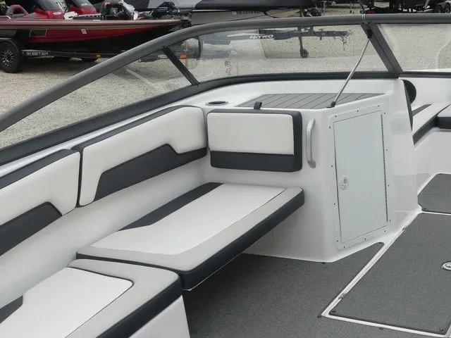 Slide: The Image of Interior of a 2019 Yamaha AR195 boat with white and gray seating. - 19