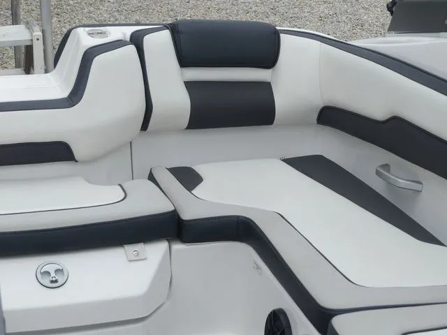 Slide: The Image of Interior of a 2019 Yamaha AR195 boat with white and black seating. - 24
