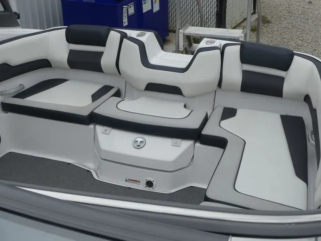 Slide: The Image of Interior of a 2019 Yamaha AR195 boat with white and black seating. - 34