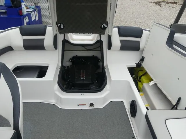 Slide: The Image of Interior of a 2019 Yamaha AR195 boat with open engine compartment. - 36