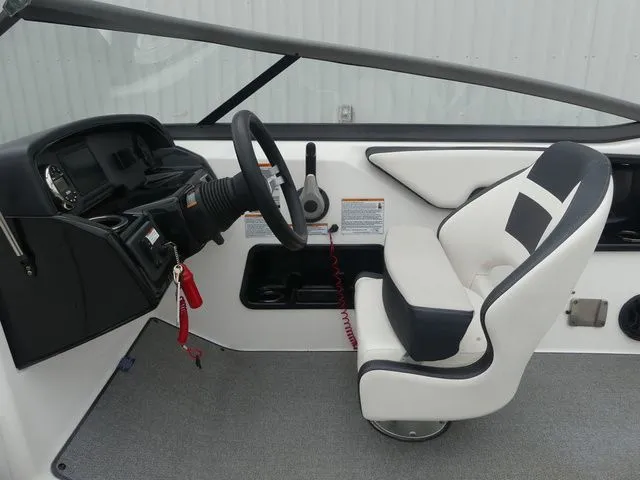 Slide: The Image of Interior of a 2019 Yamaha AR195 boat with steering and seat. - 46