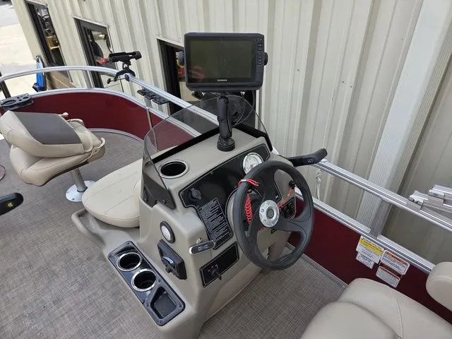 Slide: The Image of 2025 Sun Tracker Bass Buggy 16 XL Select helm console. - 10