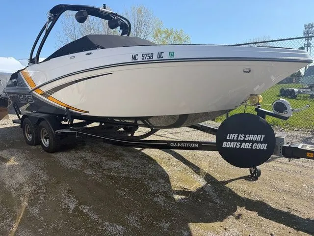 The Image of 2017 Glastron GTS245 boat on trailer with humorous quote. - 1