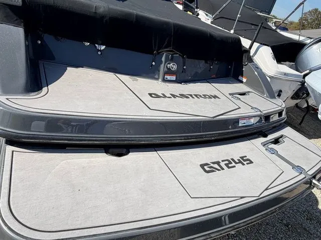 Slide: The Image of 2017 Glastron GTS245 boat rear view outdoors. - 3