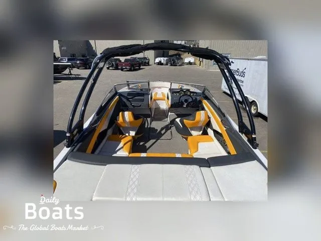 Slide: The Image of Interior view of a 2017 Glastron GTS245 boat with orange seating. - 4