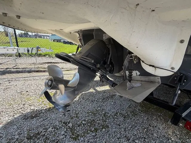 Slide: The Image of Rear view of a 2017 Glastron GTS245 boat engine on gravel. - 5