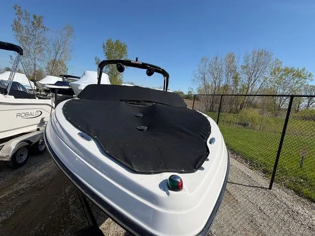 Slide: The Image of 2017 Glastron GTS245 boat with cover on a trailer. - 6