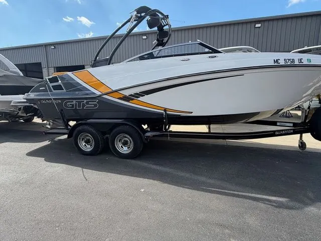 Slide: The Image of 2017 Glastron GTS245 boat on trailer outside warehouse. - 9