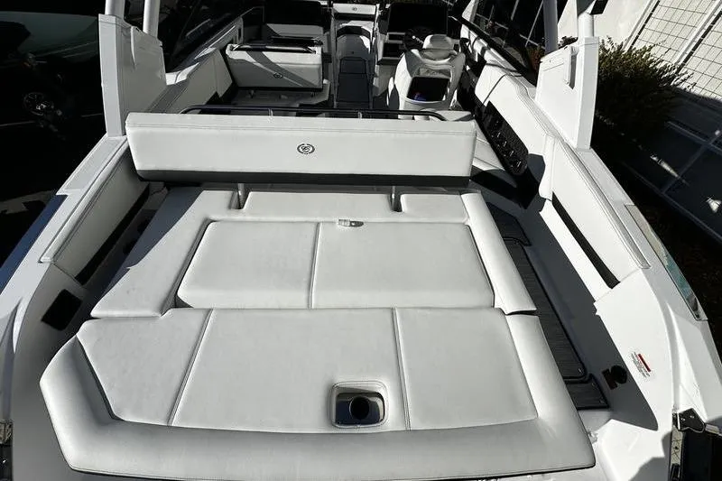 Slide: The Image of 2025 Cobalt R4 boat interior with luxurious white seating and modern design. - 3