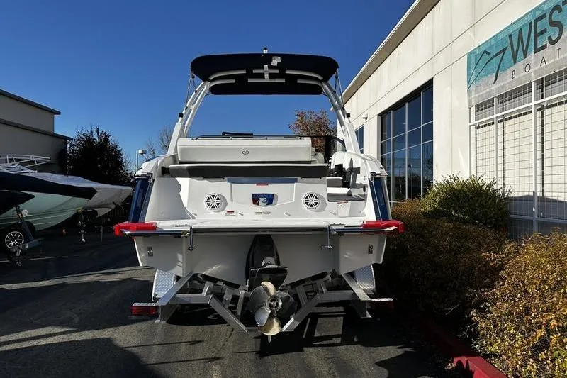 Slide: The Image of 2025 Cobalt R4 boat rear view at dealership, showcasing sleek design and modern features. - 4