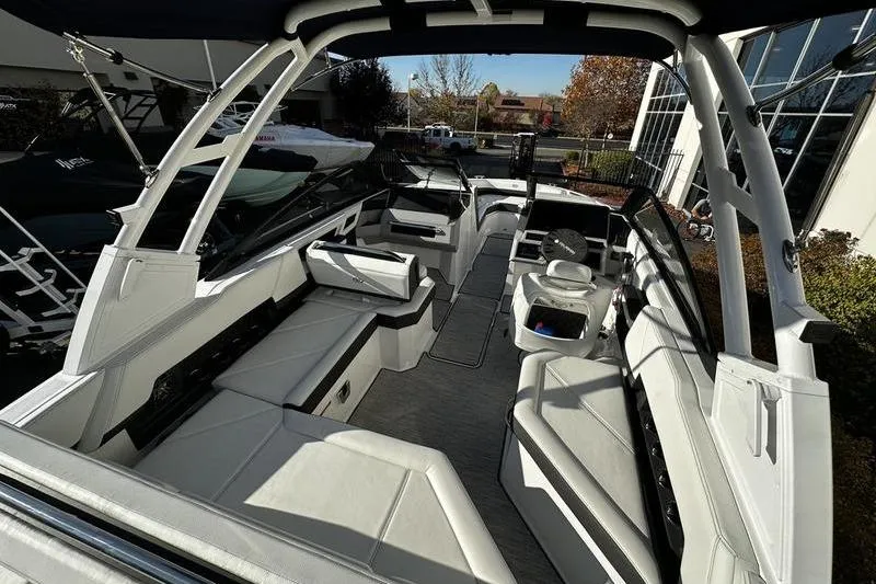 Slide: The Image of 2025 Cobalt R4 boat interior with sleek white seating and modern design. - 5