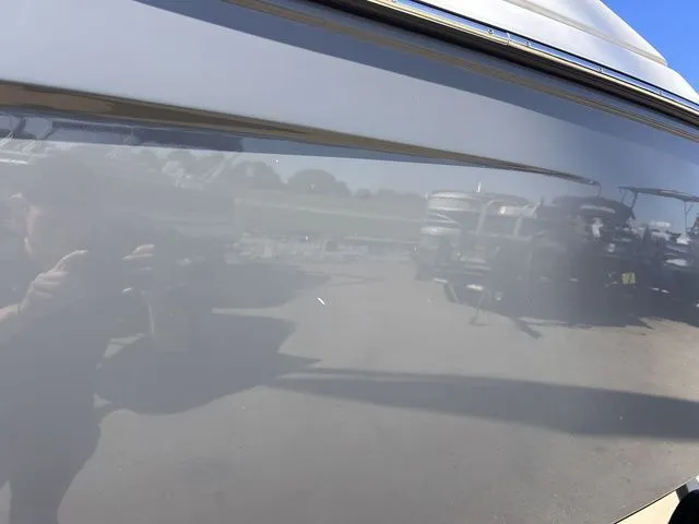 Slide: The Image of Close-up of the shiny surface of a 2021 Yamaha 275SE boat. - 16