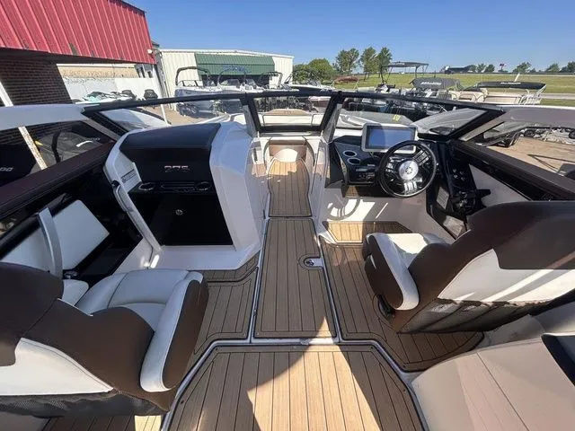 Slide: The Image of Interior view of a 2021 Yamaha Boats 275SE with luxurious seating. - 21
