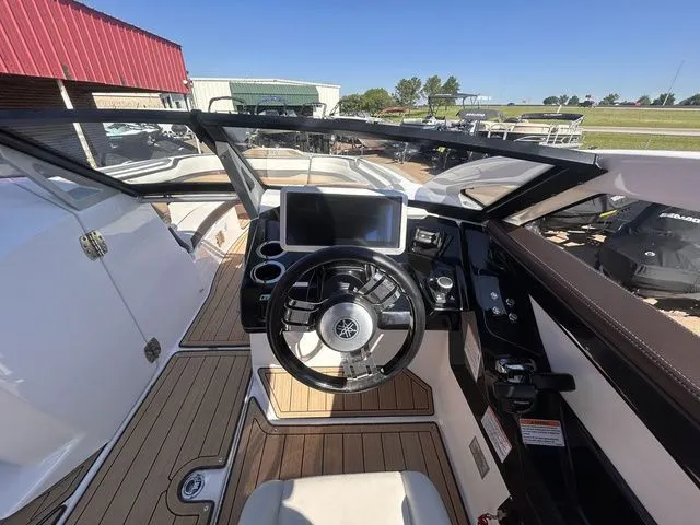 Slide: The Image of Interior view of 2021 Yamaha Boats 275SE cockpit with modern controls. - 22