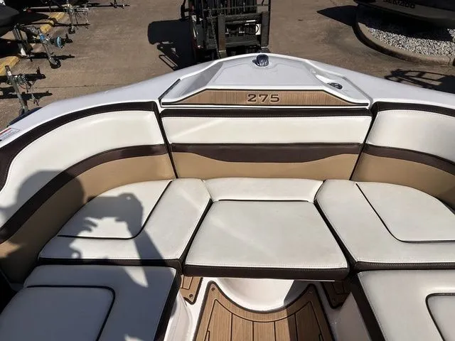 Slide: The Image of Interior of a 2021 Yamaha Boats 275SE with beige upholstery. - 27
