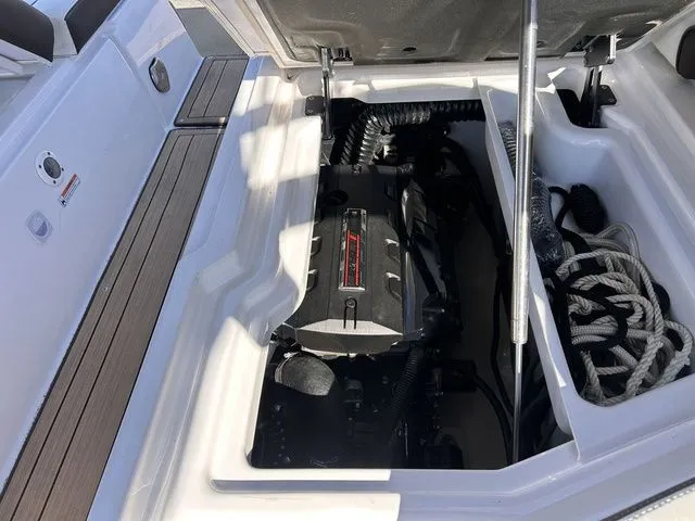 Slide: The Image of Engine compartment of a 2021 Yamaha Boats 275SE with open hatch. - 37