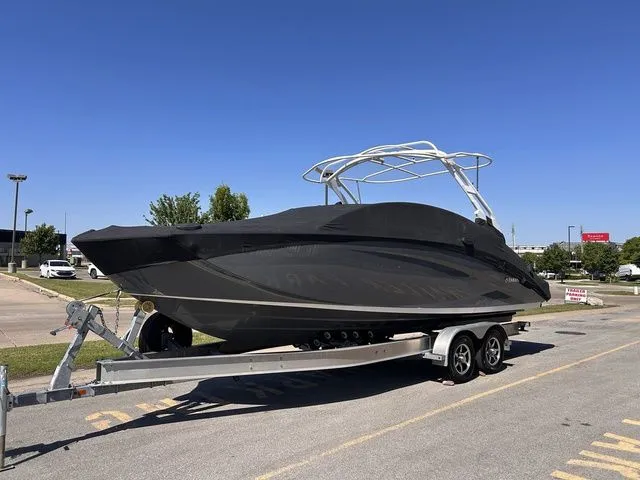 Slide: The Image of 2021 Yamaha Boats 275SE on trailer, covered, sunny day. - 49