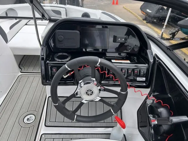 Slide: The Image of Yamaha Boats 195S 2024 steering console with wheel and controls. - 11